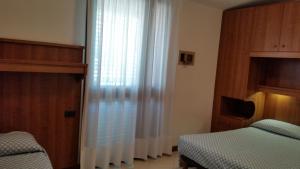Posteľ alebo postele v izbe v ubytovaní Hotel Acapulco