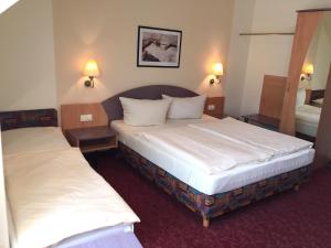 Postel nebo postele na pokoji v ubytování Hotel Gasthof Krone