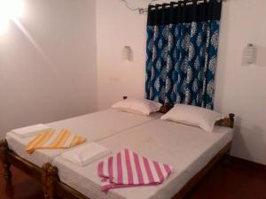 Marari Babu Homestay客房内的一张或多张床位