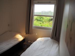 Postel nebo postele na pokoji v ubytování Hillesgården