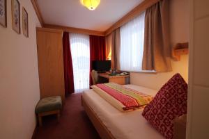 Posteľ alebo postele v izbe v ubytovaní Hotel Garni Lärchenhof