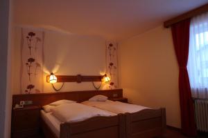 Posteľ alebo postele v izbe v ubytovaní Hotel Garni Lärchenhof