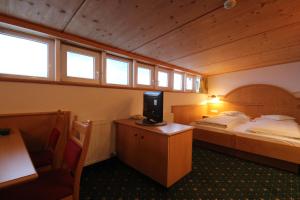 Posteľ alebo postele v izbe v ubytovaní Hotel Garni Lärchenhof