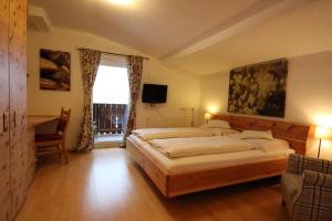 Posteľ alebo postele v izbe v ubytovaní Hotel Garni Lärchenhof