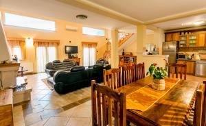 a living room with a table and a couch at Villa Besha in Herceg-Novi