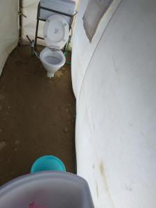 a bathroom with a toilet in a room at Garjha Hill Sight Trekking & Camping in Sir Bhum Chun