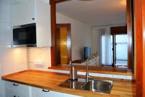 TV a/nebo společenská místnost v ubytování Apartamento con Jardín Platja d'Aro
