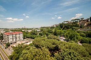 an aerial view of a city with trees and buildings at Guest House Vignola in Rome