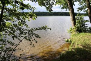 a view of a large body of water with trees at Fahrradpension am Weg nach Kopenhagen in Fürstenberg-Havel +12 photos