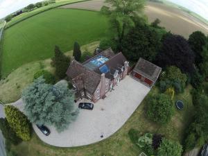 an aerial view of a house with a driveway at B&B Dorwyn Manor in Avebury