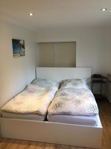Postel nebo postele na pokoji v ubytování Ferienwohnung auf dem Resthof