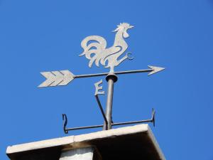 a sign on top of a building with a dragon on it at Case Vacanza ARCO SANT'ANTONIO in Bisceglie