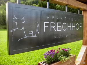 a sign for a farmers refrigerator with a cow on it at Apartments Frechhof in Schladming