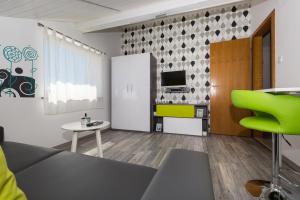 Kuchyň nebo kuchyňský kout v ubytování Apartments & Rooms Laganini