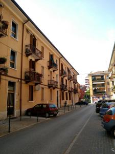 a street with cars parked on the side of a building at Apartment Nice Venice in Mestre