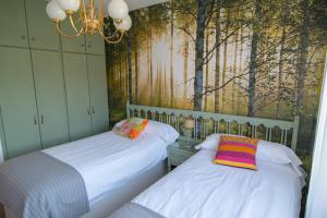 A bed or beds in a room at El Jardin de Manuela