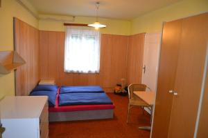Posteľ alebo postele v izbe v ubytovaní Hostel Fortuna