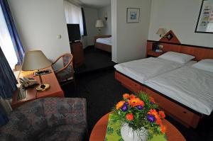 
Ein Bett oder Betten in einem Zimmer der Unterkunft Hotel Stadt Reinfeld
