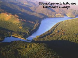 a view of a river in a valley with forests at Gästehaus Bündge in Kamschlacken