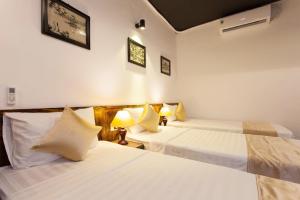 Ένα ή περισσότερα κρεβάτια σε δωμάτιο στο Luxury Backpakers Hotel