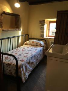Letto o letti in una camera di Alloggio del Grand Tour