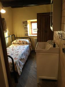 Letto o letti in una camera di Alloggio del Grand Tour