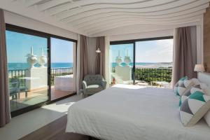a bedroom with a bed and a view of the ocean at TUI Blue Isla Cristina Palace - Adults Recommended in Isla Cristina