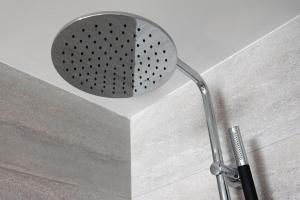 a shower head in the corner of a bathroom at TUI Blue Isla Cristina Palace - Adults Recommended in Isla Cristina