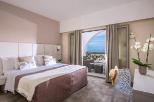Postel nebo postele na pokoji v ubytování Hotel Matheo Villas & Suites