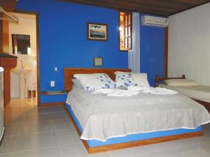 Cama ou camas em um quarto em Pousada Caúca