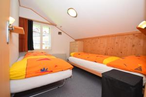 Postel nebo postele na pokoji v ubytování Chalet Bim Chilchli