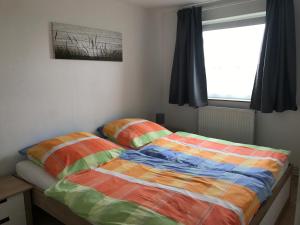 Postel nebo postele na pokoji v ubytování Haus Heverstrom