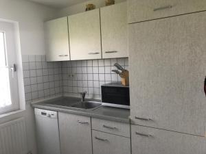 Kuchyň nebo kuchyňský kout v ubytování Haus Heverstrom