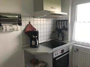 Kuchyň nebo kuchyňský kout v ubytování Haus Heverstrom