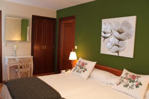 Łóżko lub łóżka w pokoju w obiekcie Hotel Montero