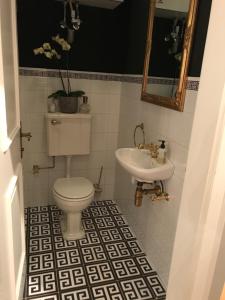 a bathroom with a toilet and a sink at Apartment Lakeside in Salzburg