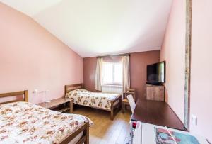 Rúm í herbergi á Guest House 15