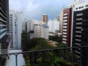 a view of a city from a balcony at Paulista Flat in São Paulo