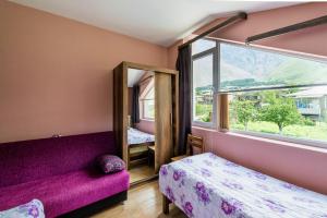 Rúm í herbergi á Guest House 15