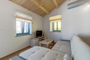 TV a/nebo společenská místnost v ubytování Apartments Relax