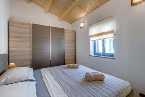 Postel nebo postele na pokoji v ubytování Apartments Relax