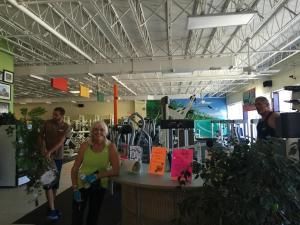a group of people standing around a counter in a store at Beautiful Ocean view Townhouse in Cocoa Beach