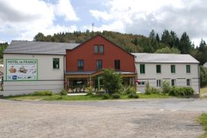 a couple of buildings sitting next to each other at Hotel de France in Chaudeyrac