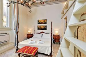 a bedroom with a bed and two tables and a window at Boccaccio 22 in Rome