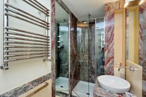 a bathroom with a sink and a shower at Boccaccio 22 in Rome +53 photos