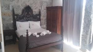 Cama o camas de una habitación en Villas da Quintã