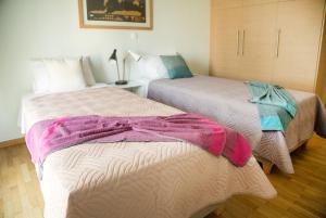 A bed or beds in a room at The Grove House