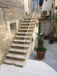 a set of stairs leading to a building at Studio apartman Ana in Split