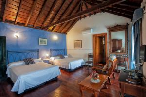 Postel nebo postele na pokoji v ubytování Hotel Rural Senderos de Abona