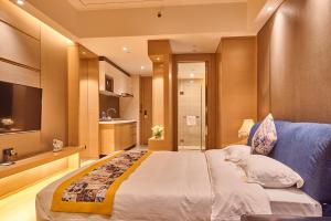 Heefun International Apartment - Zhujiang New Town FuLi Brand New World Plaza客房内的一张或多张床位